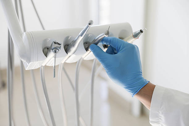 Professional Tooth Extraction technician working in Rosharon, TX